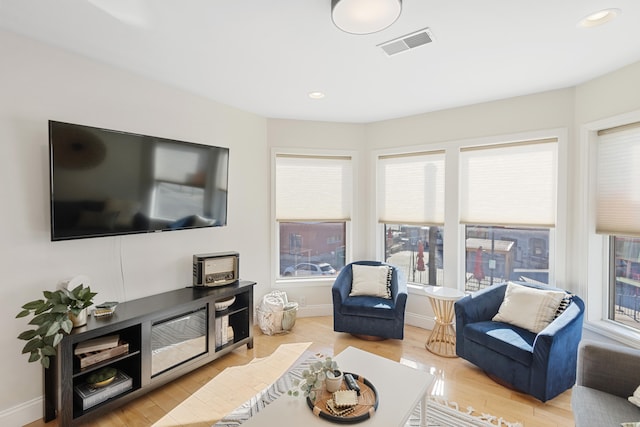 living room with light hardwood / wood-style floors