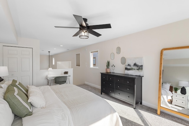 bedroom featuring ceiling fan, a closet, and light colored carpet