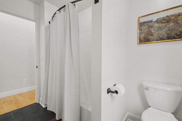 bathroom with wood-type flooring and toilet