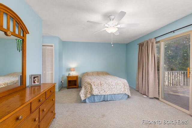 bedroom with access to outside, a closet, light colored carpet, and ceiling fan