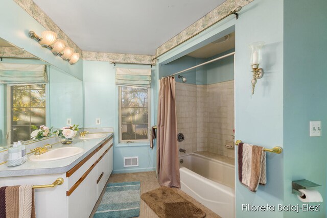 bathroom with vanity and shower / tub combo