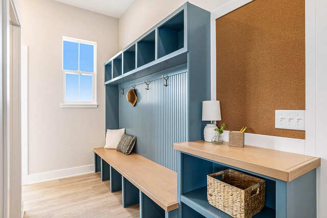 mudroom with light hardwood / wood-style floors