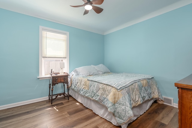 bedroom with hardwood / wood-style flooring and ceiling fan