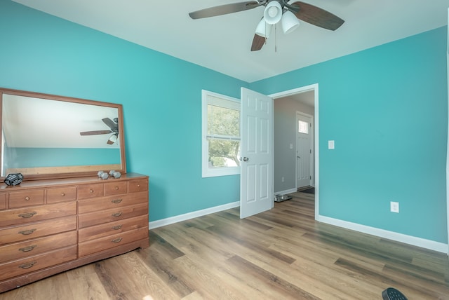 bedroom with ceiling fan and light hardwood / wood-style flooring