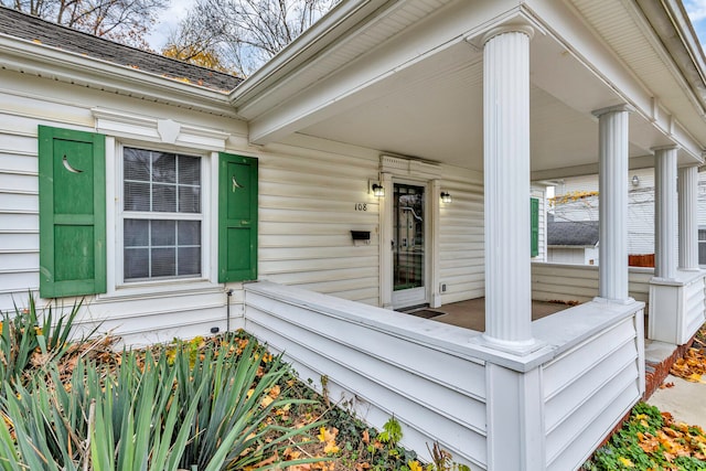 entrance to property featuring a porch