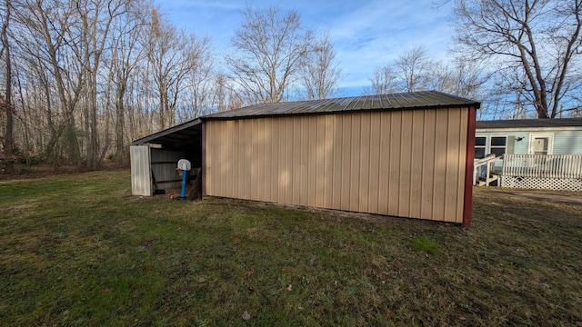 view of outbuilding with a lawn