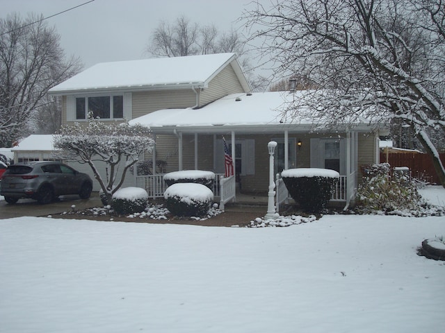 view of front of house featuring covered porch and a garage