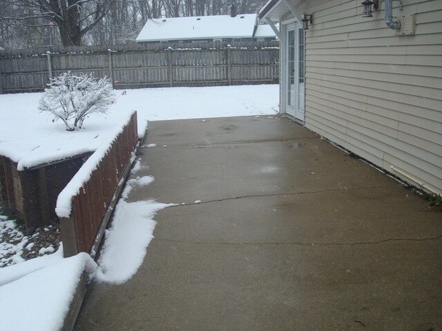 view of snow covered patio