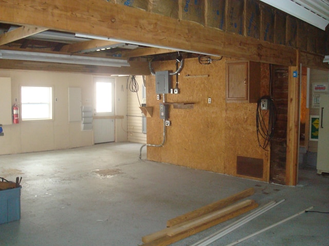 basement with plenty of natural light and electric panel