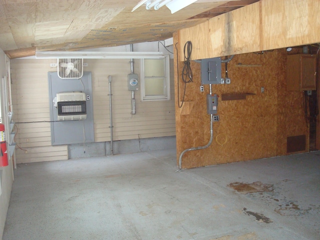 basement with heating unit and electric panel