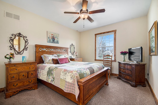 bedroom with ceiling fan and light colored carpet