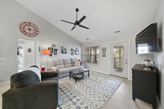 living room featuring ceiling fan, high vaulted ceiling, and light hardwood / wood-style flooring