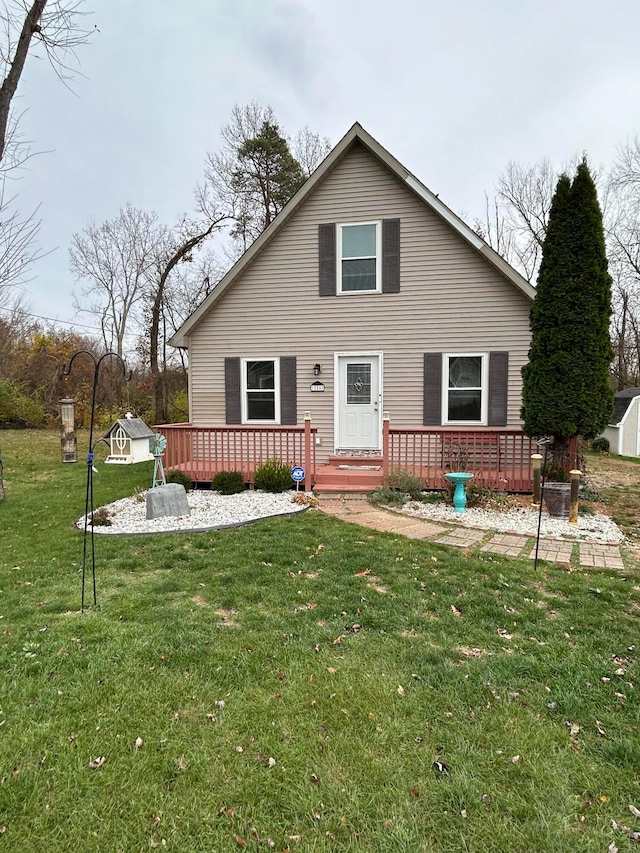 back of house featuring a lawn, a shed, and a deck