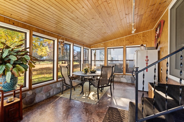 unfurnished sunroom featuring plenty of natural light, wooden ceiling, and lofted ceiling