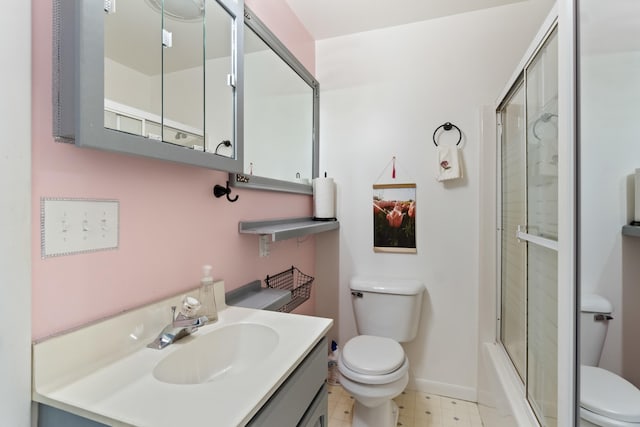 full bathroom featuring shower / bath combination with glass door, vanity, and toilet