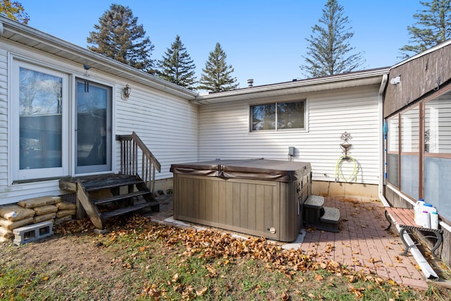 exterior space with a hot tub