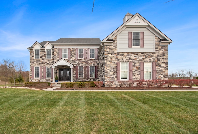 view of front of home featuring a front yard