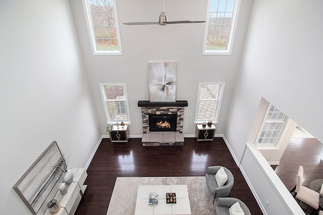 living room featuring a wealth of natural light and a towering ceiling