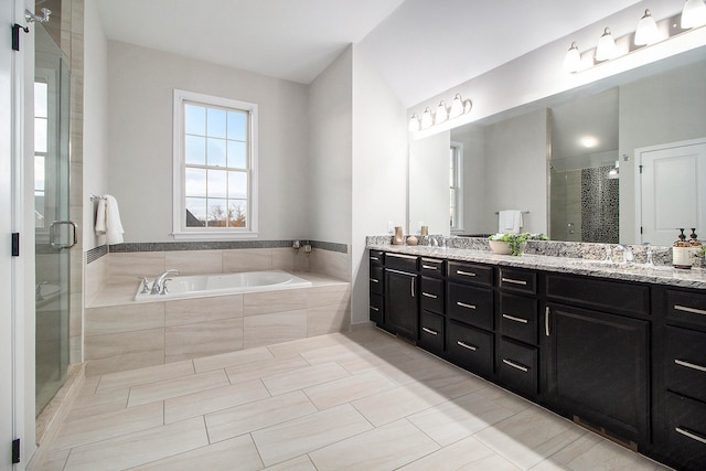 bathroom featuring tile patterned flooring, vanity, and independent shower and bath