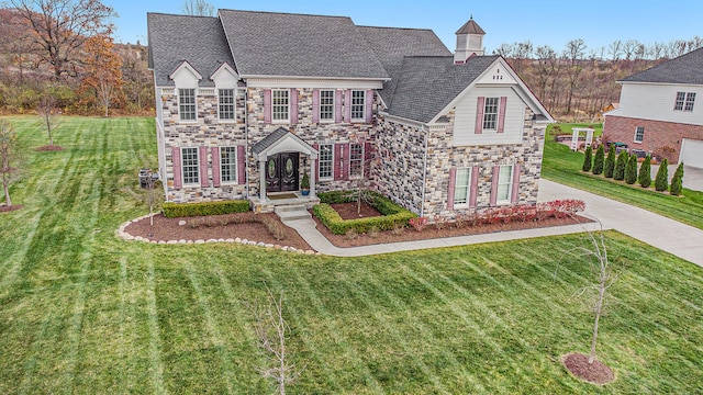 view of front of property with a front lawn