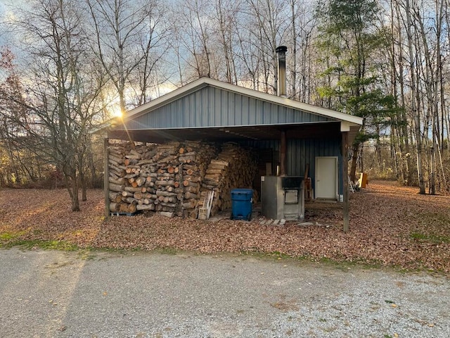 view of side of property featuring a carport