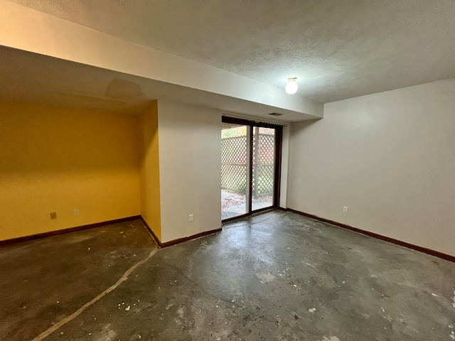 basement with a textured ceiling