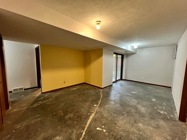 basement with a textured ceiling