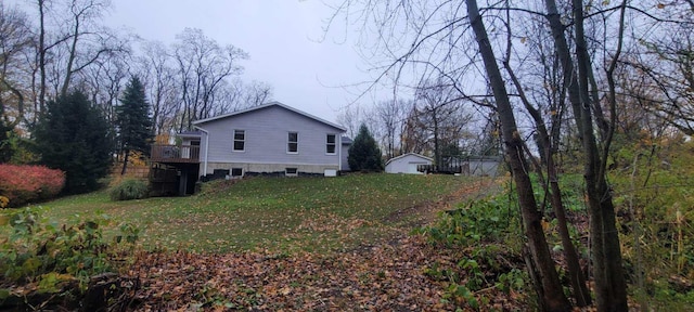 view of home's exterior featuring a deck