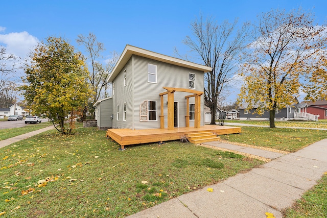 view of front facade with a pergola, a wooden deck, and a front yard