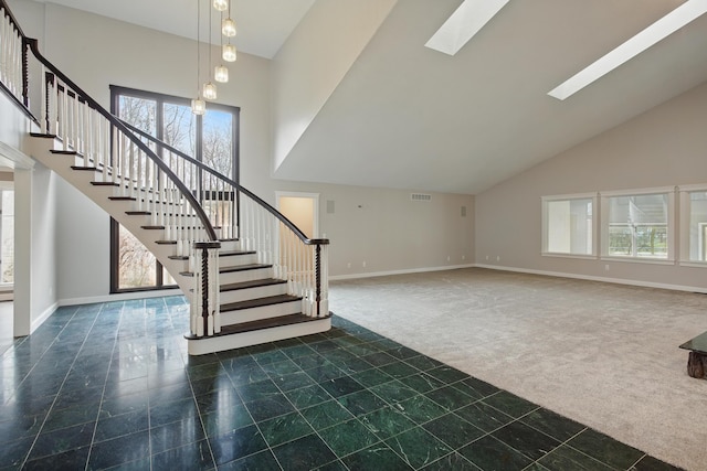 4489 Cranbrook Trl, Orchard Lake, MI 48323 - staircase with carpet, a high ceiling, baseboards, and a healthy amount of sunlight