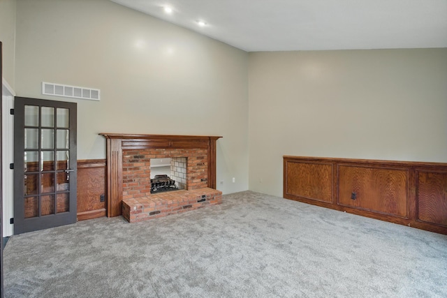 4489 Cranbrook Trl, Orchard Lake, MI 48323 - unfurnished living room with visible vents, carpet flooring, and a fireplace