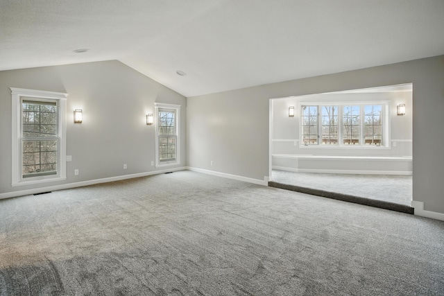 4489 Cranbrook Trl, Orchard Lake, MI 48323 - carpeted empty room with visible vents, baseboards, and vaulted ceiling