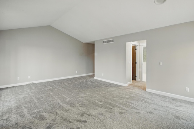 4489 Cranbrook Trl, Orchard Lake, MI 48323 - carpeted spare room featuring visible vents, baseboards, and vaulted ceiling