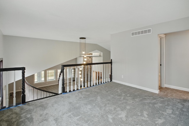 4489 Cranbrook Trl, Orchard Lake, MI 48323 - carpeted empty room featuring baseboards, lofted ceiling, and visible vents