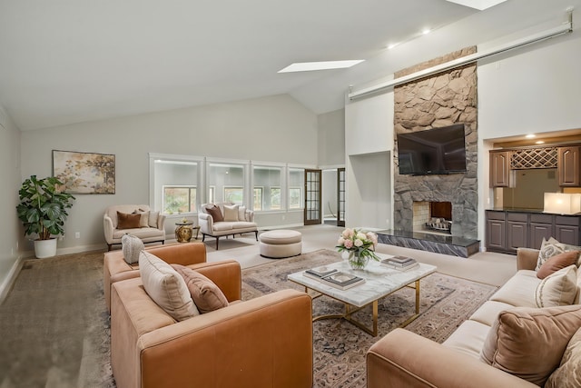 4489 Cranbrook Trl, Orchard Lake, MI 48323 - living area with high vaulted ceiling, a fireplace, carpet floors, a skylight, and baseboards