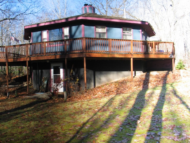 back of property with a wooden deck