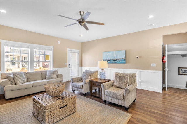 living room with hardwood / wood-style floors and ceiling fan