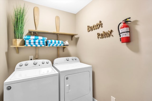 laundry area with washing machine and clothes dryer