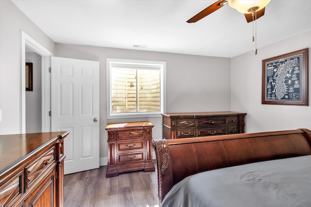 bedroom featuring hardwood / wood-style floors and ceiling fan