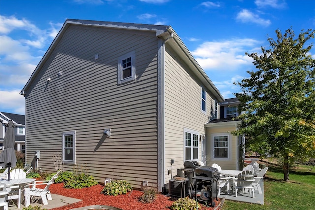 back of house featuring a patio