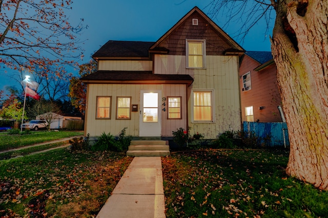 front facade with a front yard