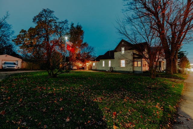 view of yard at dusk