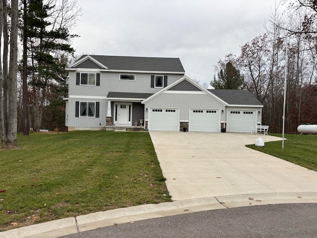 view of front property with a garage and a front yard