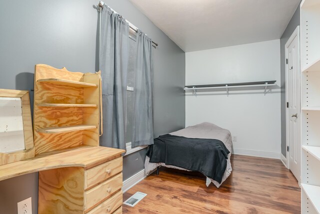 bedroom featuring hardwood / wood-style flooring