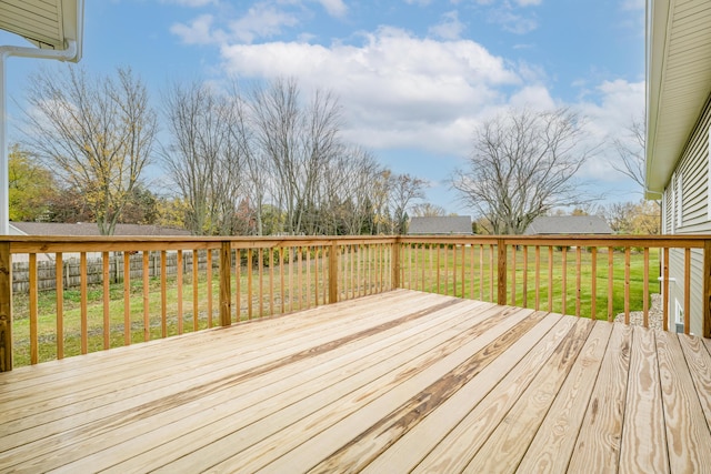 wooden terrace with a lawn