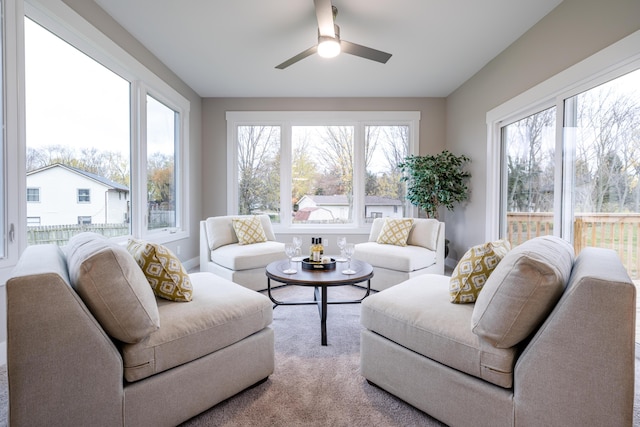 living room with carpet flooring and ceiling fan