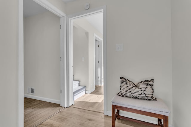 corridor featuring hardwood / wood-style flooring