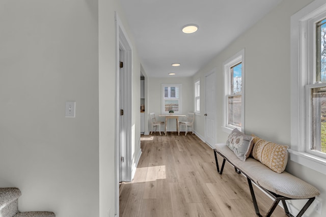 hall with light hardwood / wood-style floors