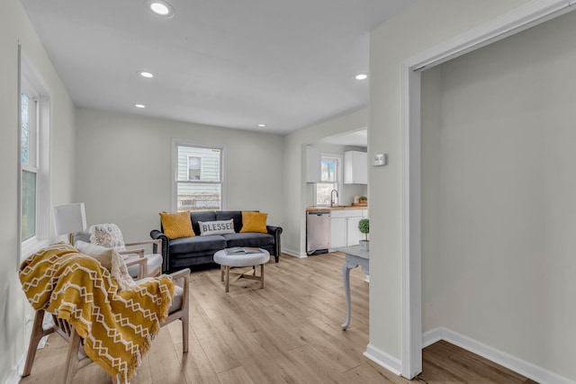 living room with light hardwood / wood-style floors