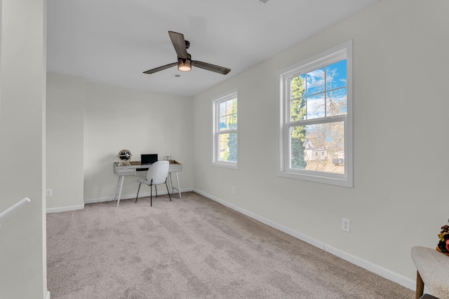 office area featuring light colored carpet and ceiling fan